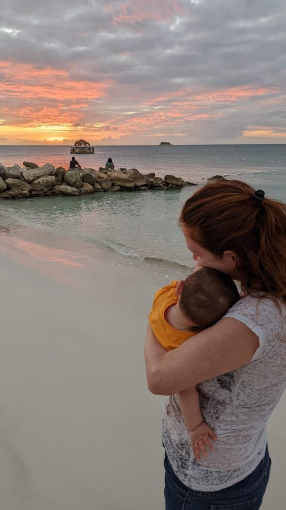 My daughter and I enjoying a beautiful sunset on Dickenson Bay, Antigua and Barbuda